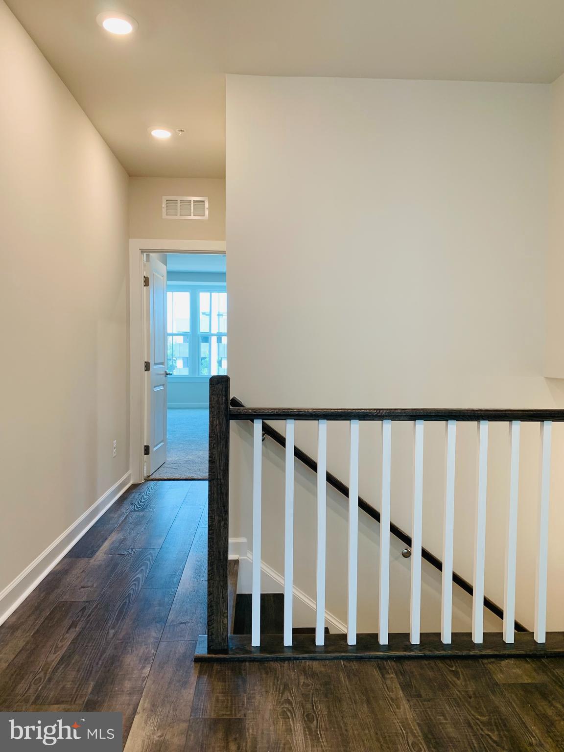 12884 Sunrise Ridge Alley, Unit 47 Herndon, VA 20171 - Photo 14 of 37 a view of wooden floor