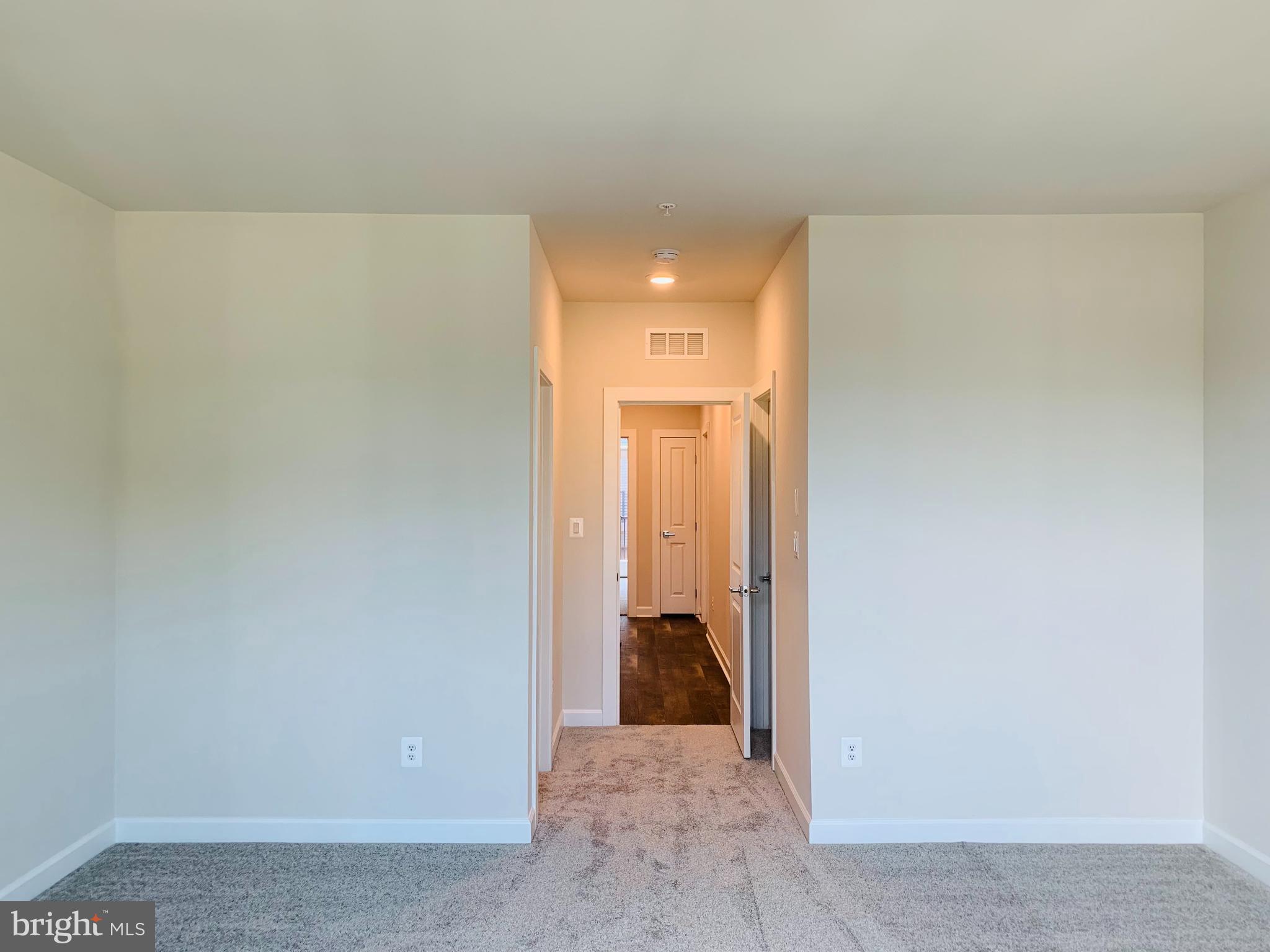 12884 Sunrise Ridge Alley, Unit 47 Herndon, VA 20171 - Photo 16 of 37 a view of a hallway with a bathroom
