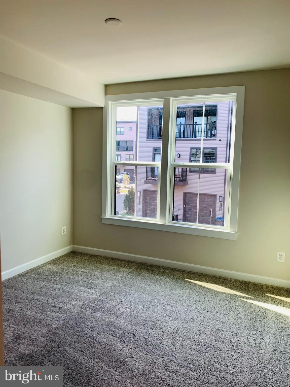 12884 Sunrise Ridge Alley, Unit 47 Herndon, VA 20171 - Photo 26 of 37 a view of an empty room with a window