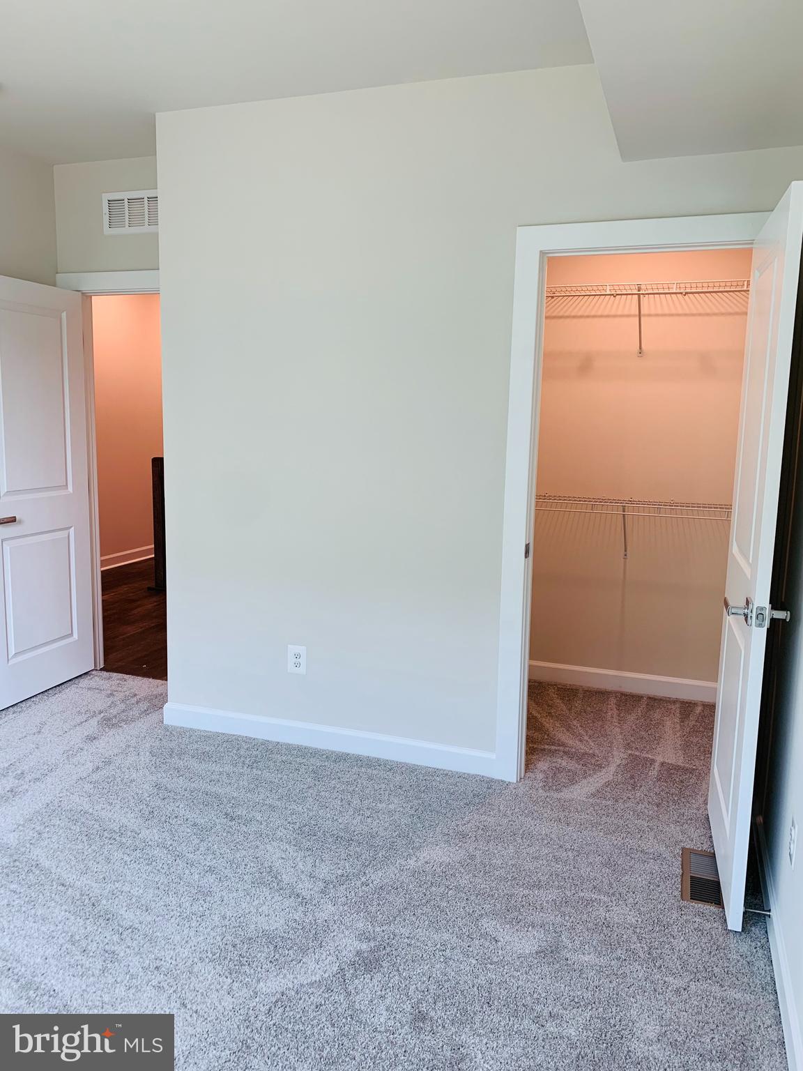 12884 Sunrise Ridge Alley, Unit 47 Herndon, VA 20171 - Photo 27 of 37 an empty room with windows