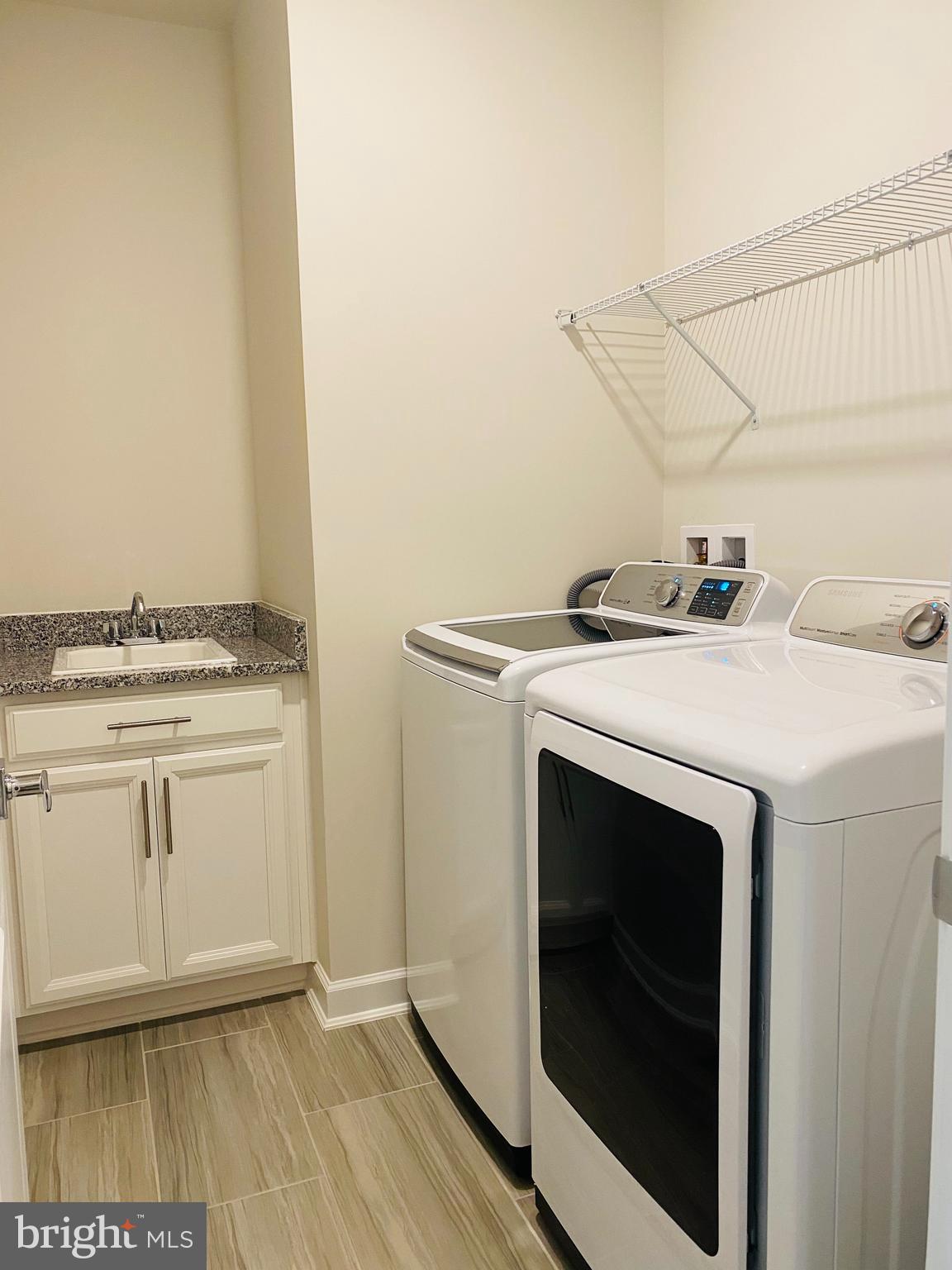 12884 Sunrise Ridge Alley, Unit 47 Herndon, VA 20171 - Photo 30 of 37 a utility room with dryer and washer