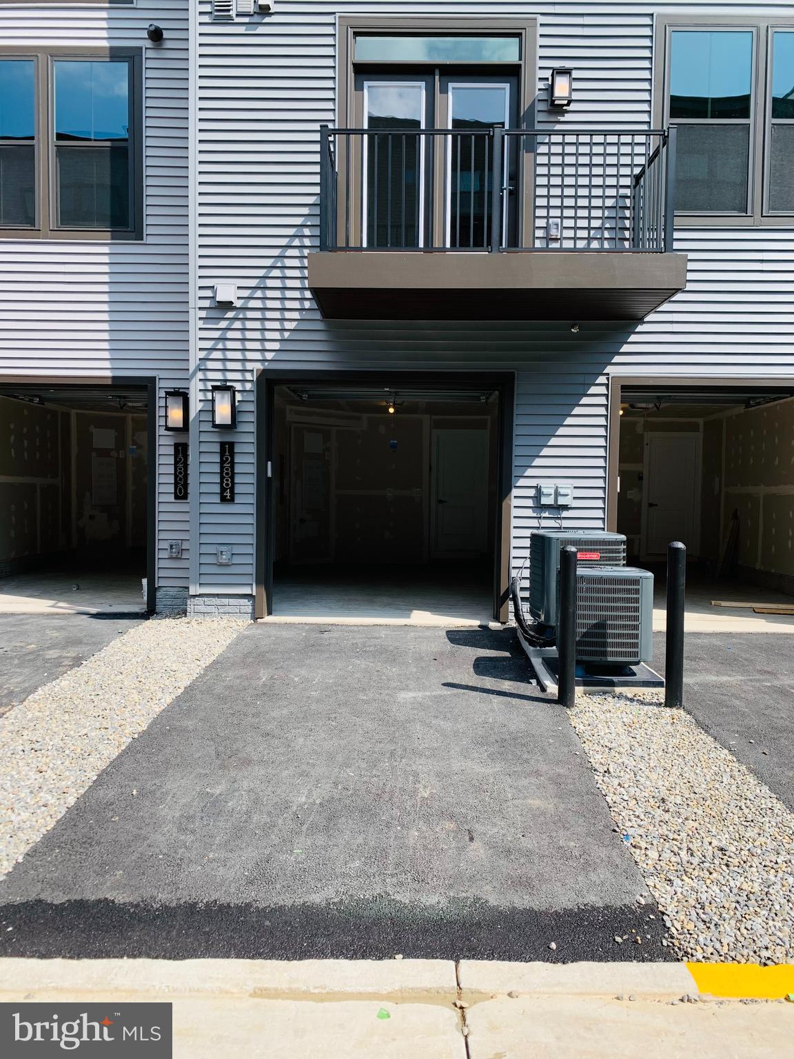 12884 Sunrise Ridge Alley, Unit 47 Herndon, VA 20171 - Photo 33 of 37 a front view of a house
