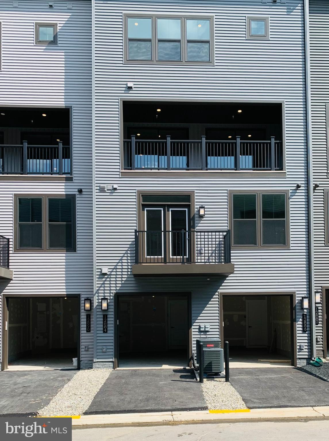 12884 Sunrise Ridge Alley, Unit 47 Herndon, VA 20171 - Photo 34 of 37 a building with a entryway