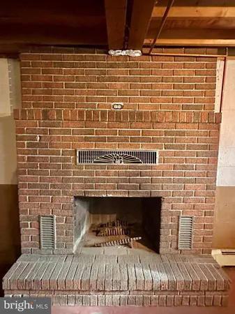 a bed sitting in a room next to a window