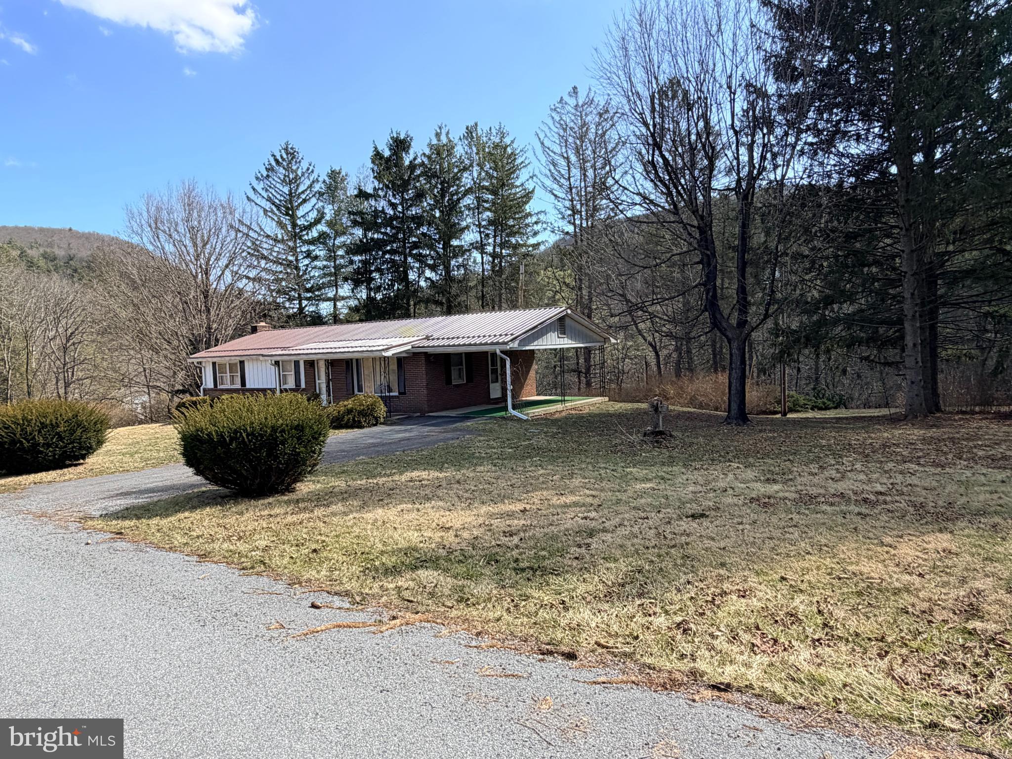 242 Gracey Road Waterfall, PA 16689 - Photo 2 of 40 a view of a house with backyard