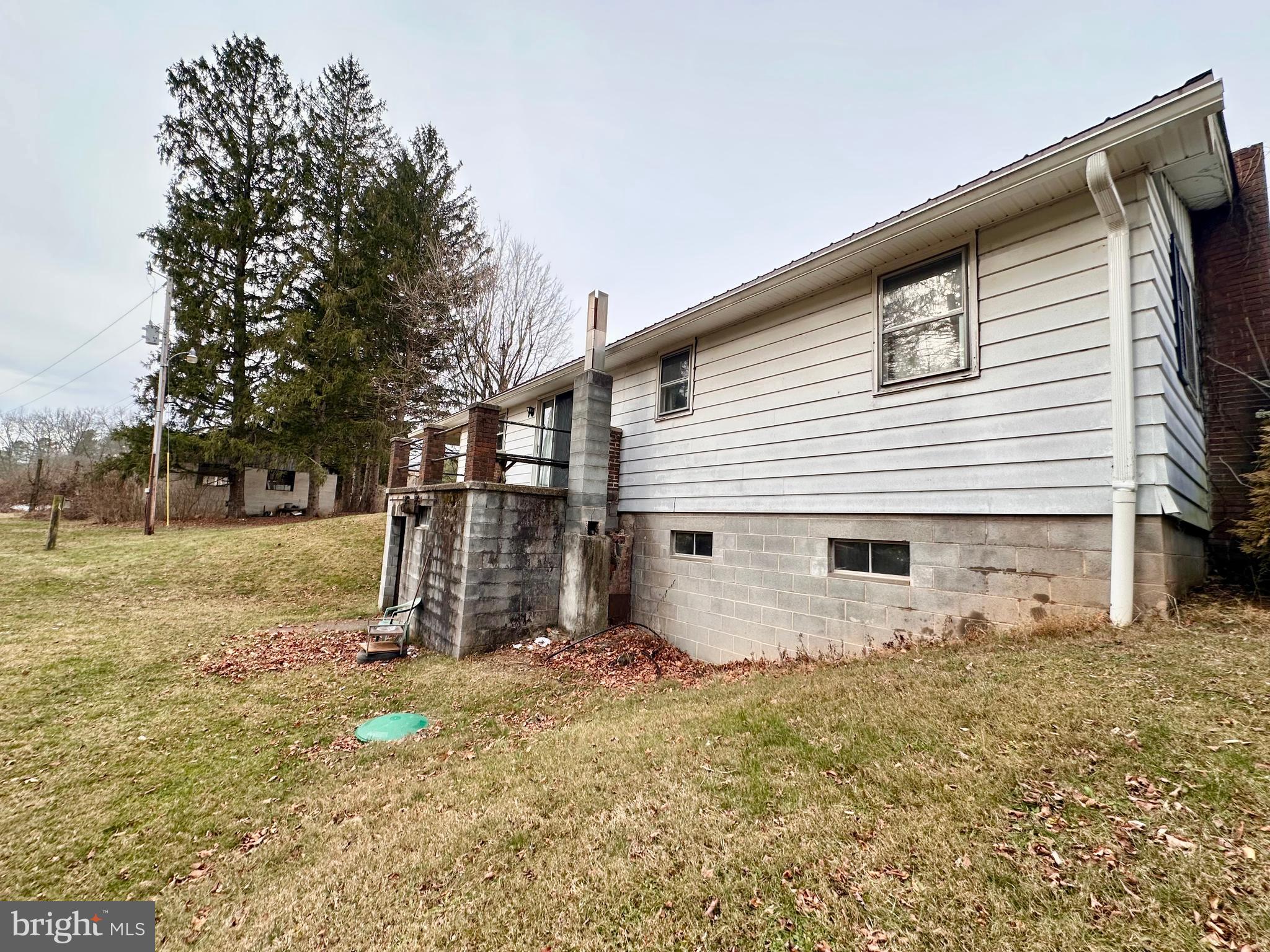 242 Gracey Road Waterfall, PA 16689 - Photo 28 of 40 a view of a house with a yard