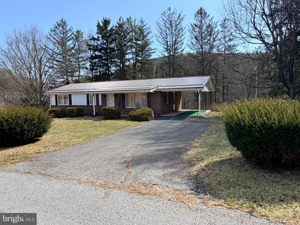 a view of a backyard of the house