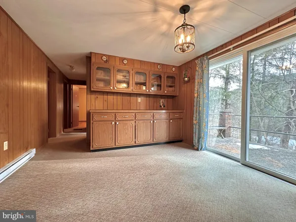 a view of livingroom with furniture and chandelier fan