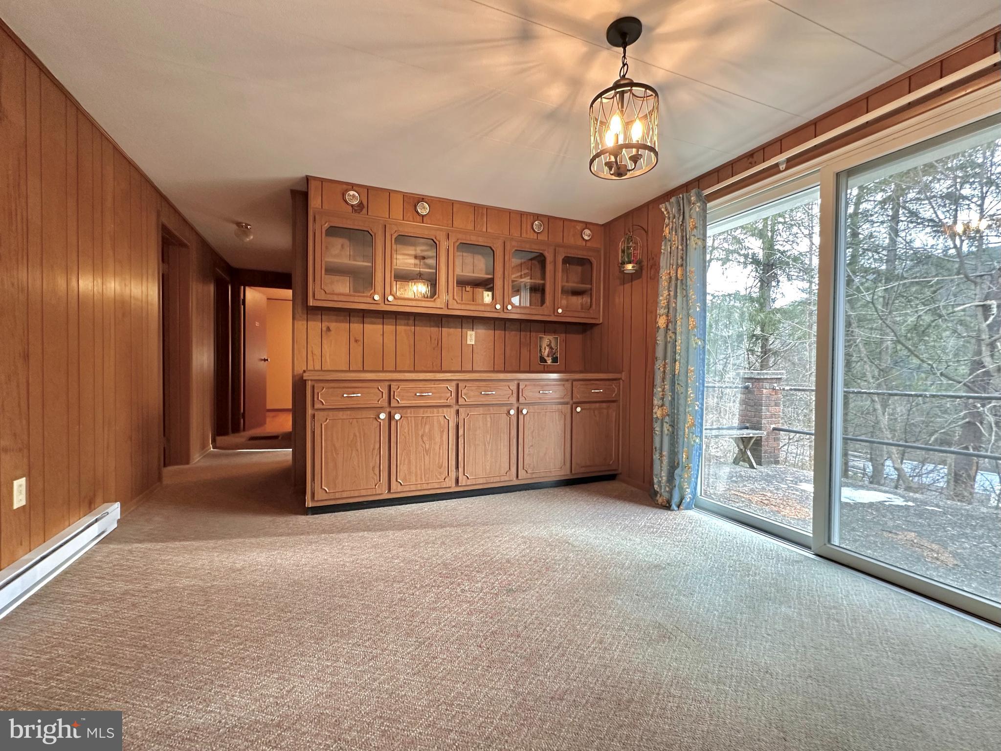 242 Gracey Road Waterfall, PA 16689 - Photo 8 of 40 a view of a hallway with a large window