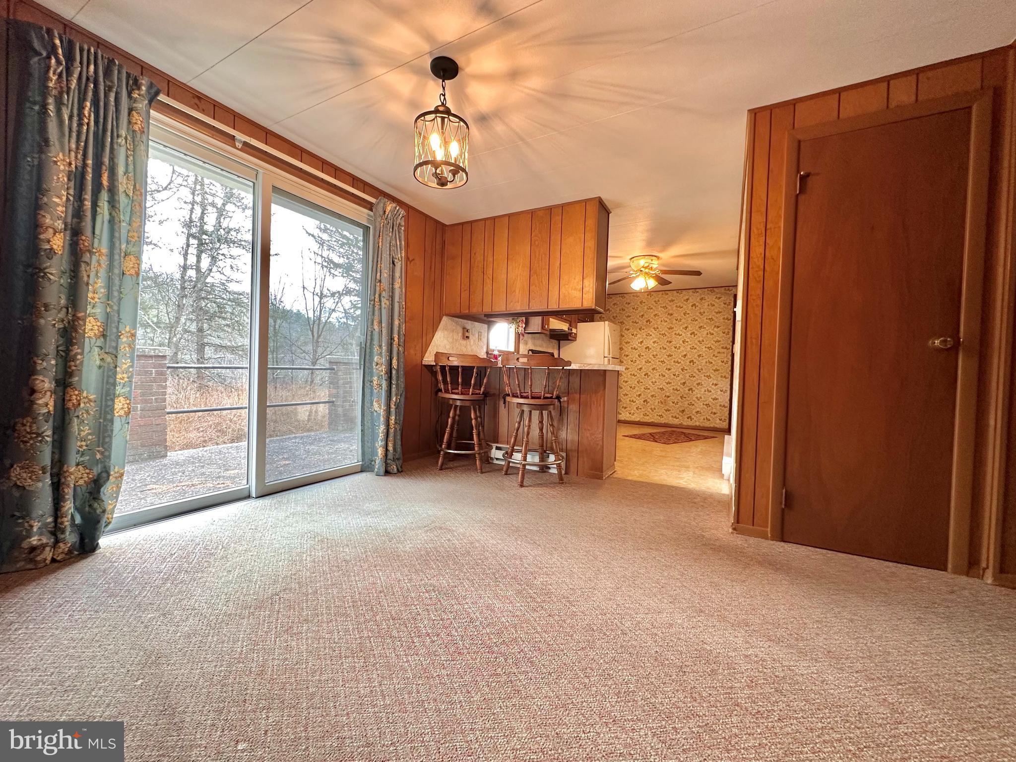 242 Gracey Road Waterfall, PA 16689 - Photo 9 of 40 a view of livingroom with furniture and chandelier fan