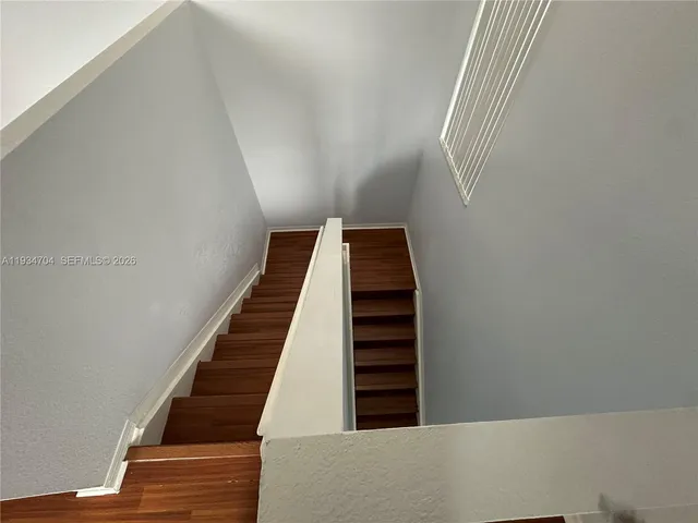 a view of entryway with wooden floor