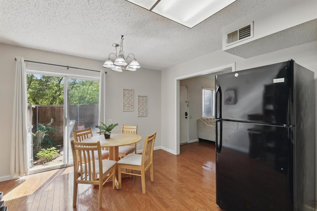 2700 Stonehaven Court Irving, TX 75038 - Photo 15 of 40 a dining room with furniture window and wooden floor