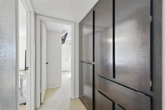 a view of a bathroom from a hallway