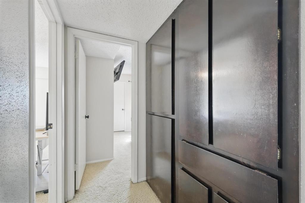 2700 Stonehaven Court Irving, TX 75038 - Photo 16 of 40 a view of a bathroom from a hallway