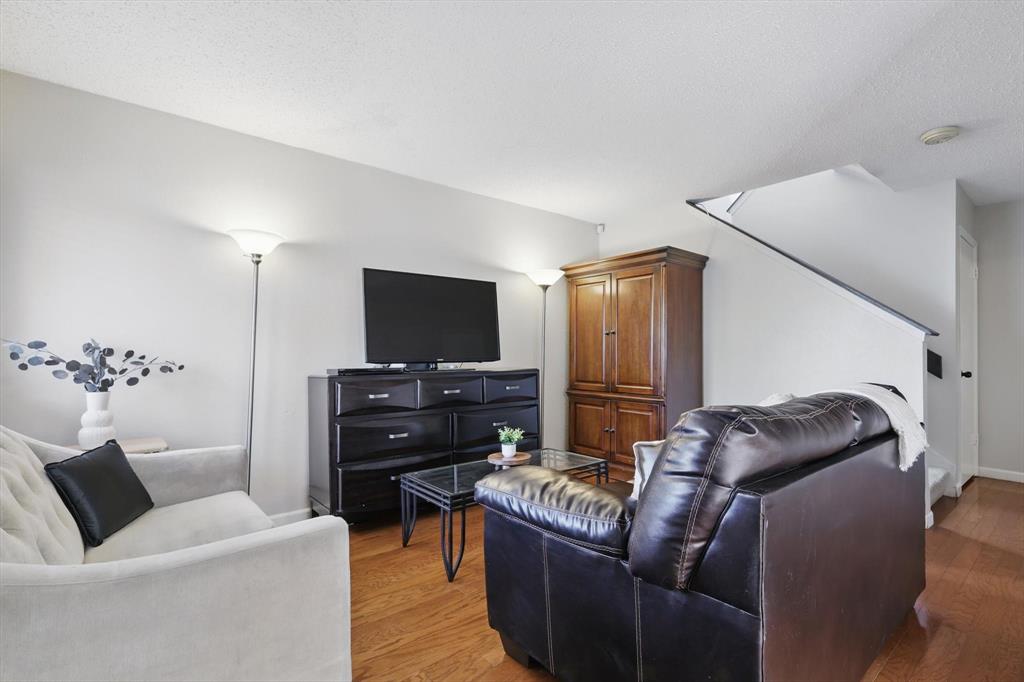 2700 Stonehaven Court Irving, TX 75038 - Photo 3 of 40 a living room with furniture and a flat screen tv