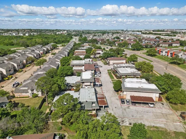 an aerial view of a houses with outdoor space