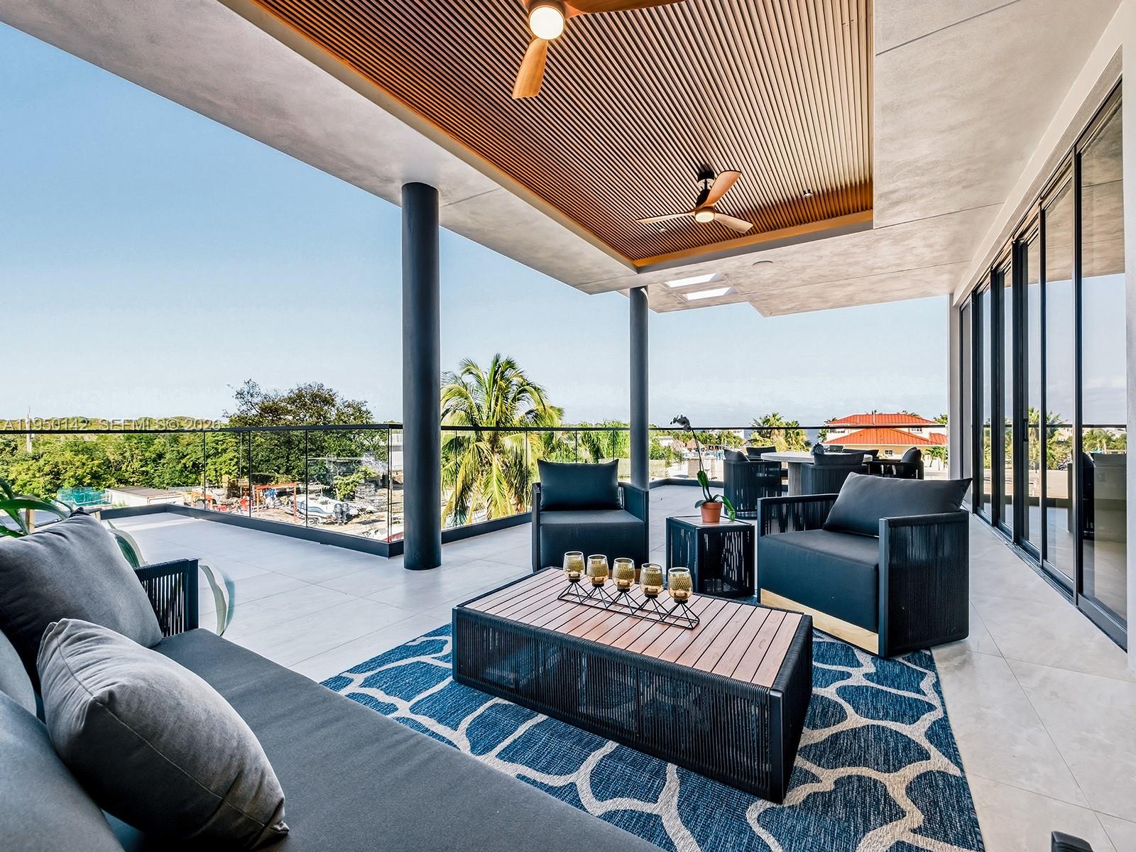 16 South Exuma Road Key Largo, FL 33037 - Photo 15 of 21 a outdoor living space with furniture potted plant