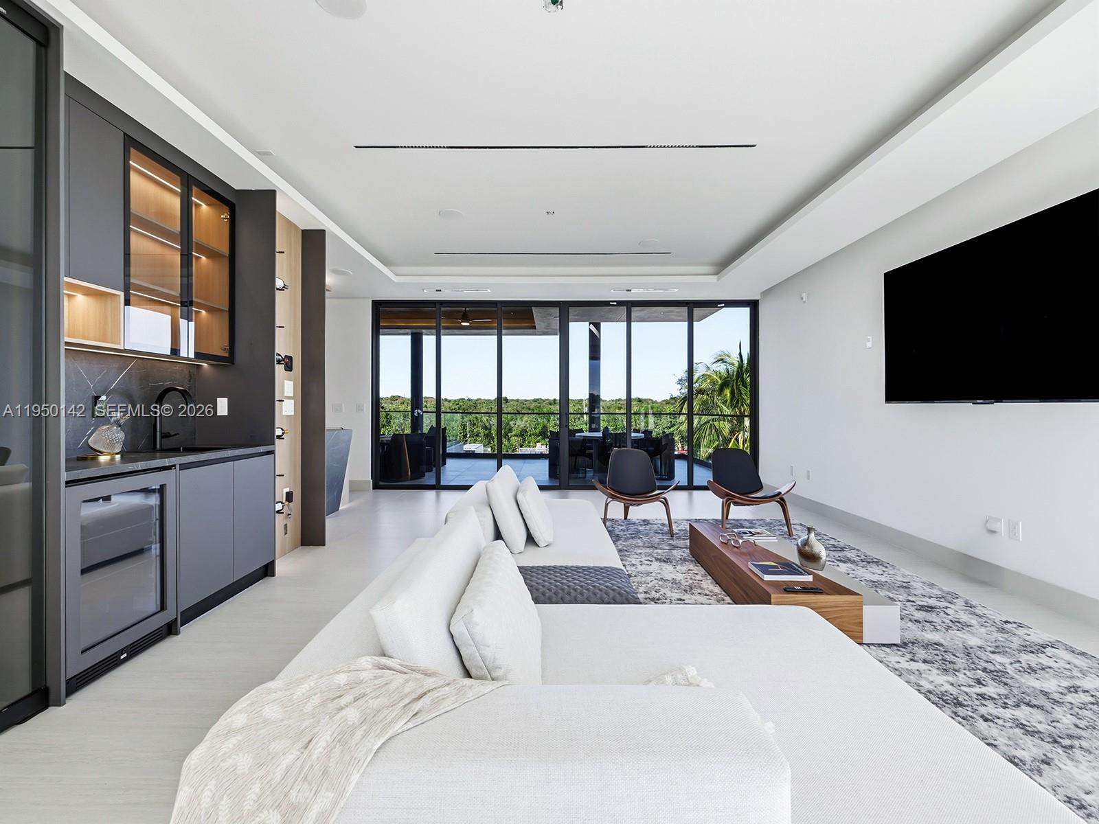 16 South Exuma Road Key Largo, FL 33037 - Photo 8 of 21 a living room with furniture and a flat screen tv