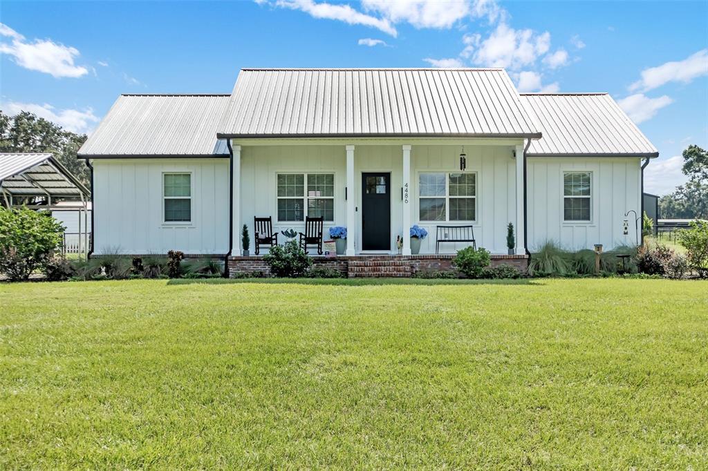 front view of a house with a yard