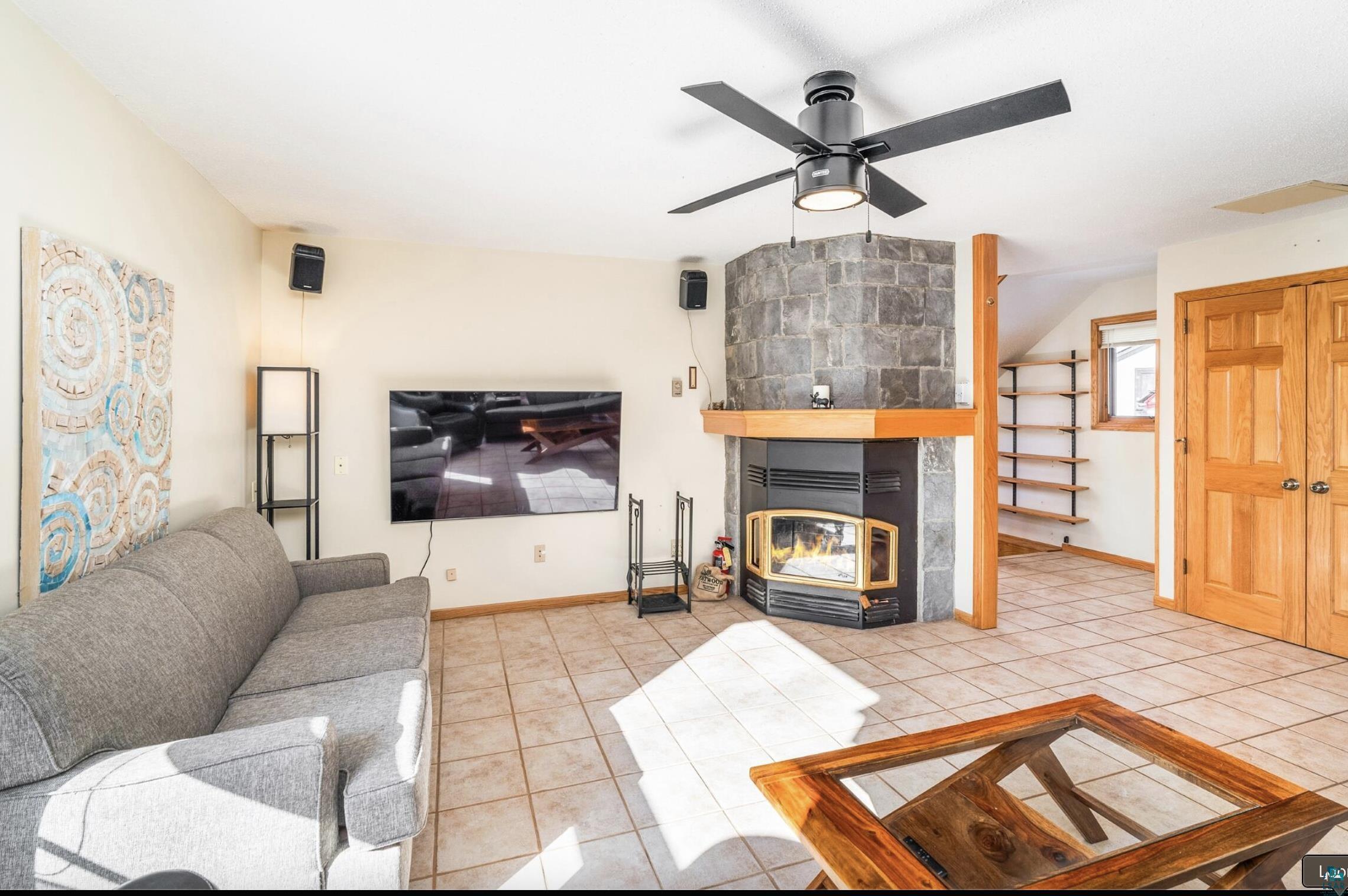 1480 Devil Track Road Grand Marais, MN 55604 - Photo 15 of 38 Living room with ceiling fan and light tile patterned flooring