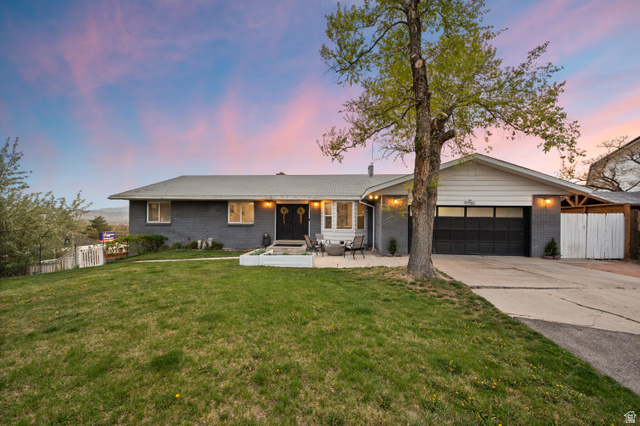 9750 Indian Ridge Drive Sandy, UT 84092 - Photo 3 of 40 Ranch-style home featuring brick siding, a garage, and concrete driveway