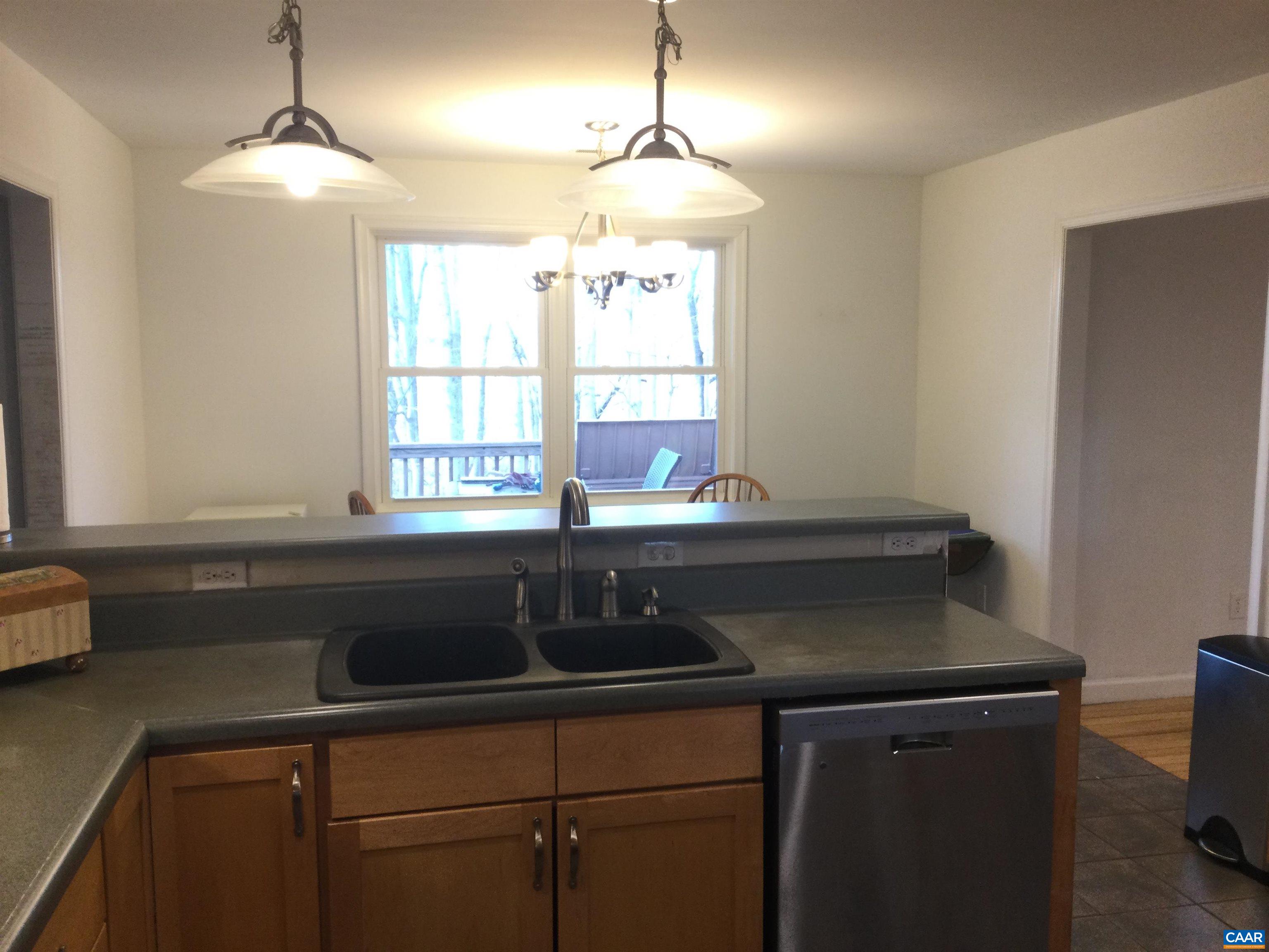 5211 Fredericksburg Road Ruckersville, VA 22968 - Photo 20 of 33 a kitchen with a sink and a window