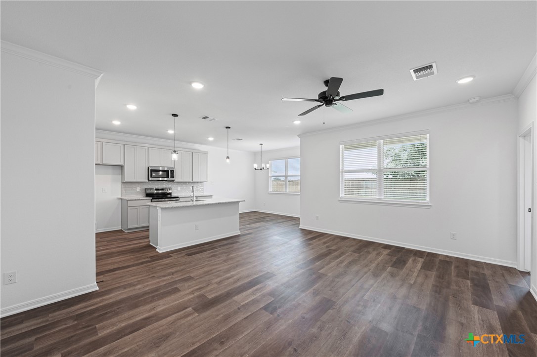 8023 Pineridge Way Temple, TX 76502 - Photo 11 of 28 a view of kitchen with refrigerator stove and wooden floor