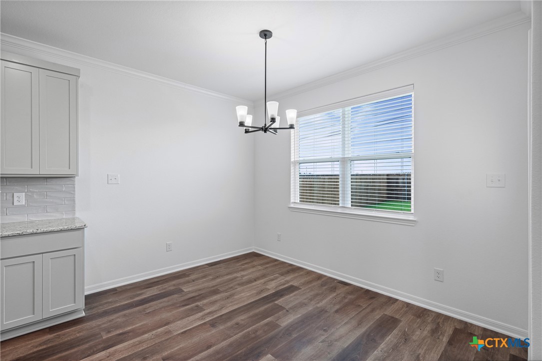 8023 Pineridge Way Temple, TX 76502 - Photo 15 of 28 a view of a kitchen with wooden floor and a window