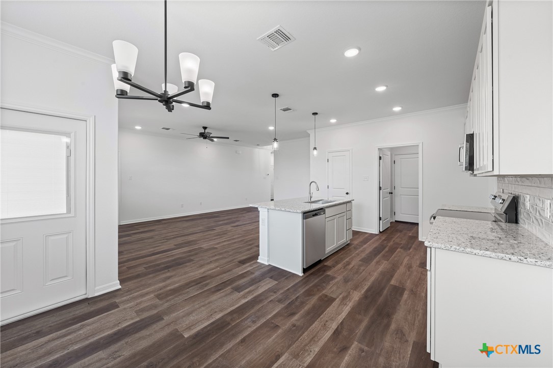 8023 Pineridge Way Temple, TX 76502 - Photo 19 of 28 a view of a kitchen with a sink and wooden floor