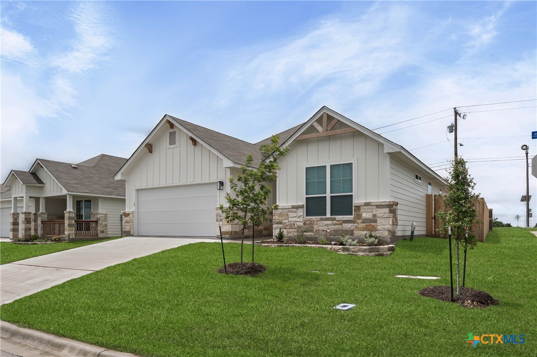 8023 Pineridge Way Temple, TX 76502 - Photo 3 of 28 a front view of house with a garden and plants