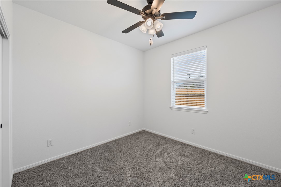 8023 Pineridge Way Temple, TX 76502 - Photo 9 of 28 an empty room with a window and a fan
