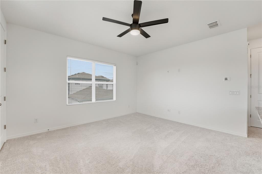 6552 Barnstorm Way St. Cloud, FL 34771 - Photo 12 of 17 a view of an empty room with a window