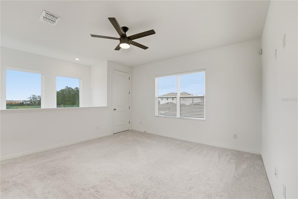 6552 Barnstorm Way St. Cloud, FL 34771 - Photo 10 of 17 a view of an empty room with a window