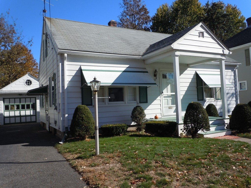 57 Grandview Street Springfield, MA 01118 - Photo 1 of 16 a front view of a house with a garden