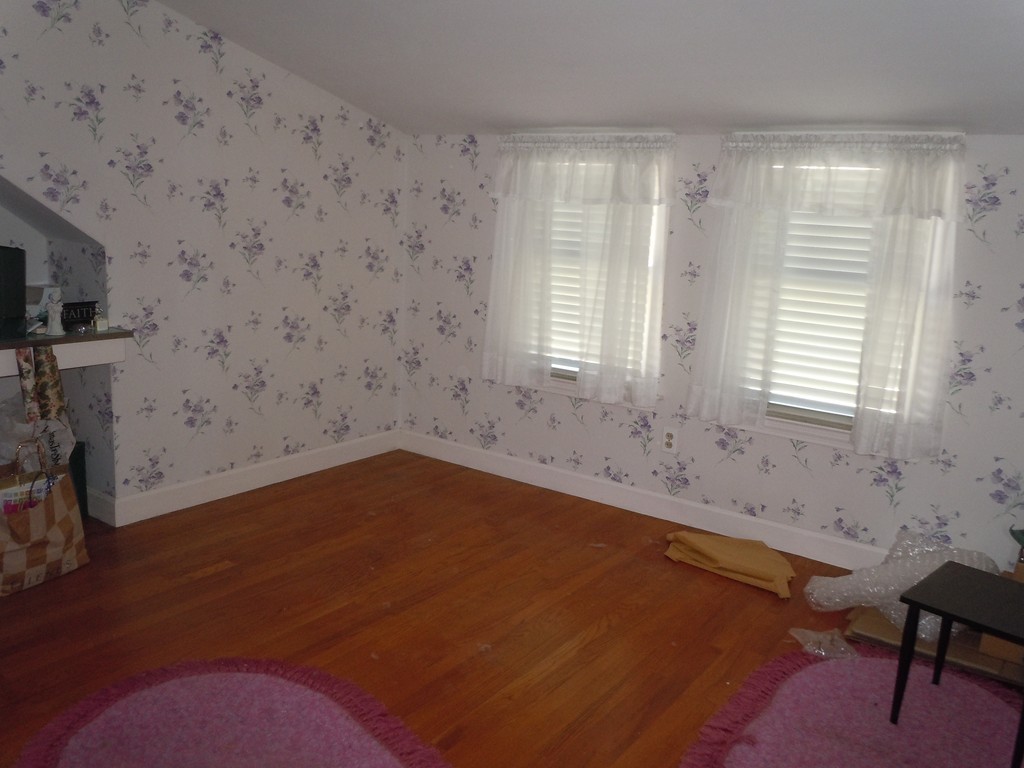57 Grandview Street Springfield, MA 01118 - Photo 11 of 16 a view of a livingroom with an empty space and a window