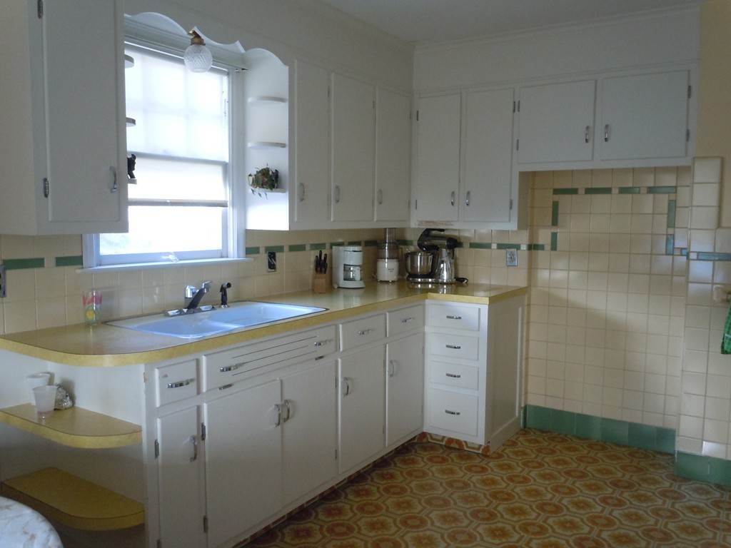 57 Grandview Street Springfield, MA 01118 - Photo 4 of 16 a kitchen with a sink cabinets and window