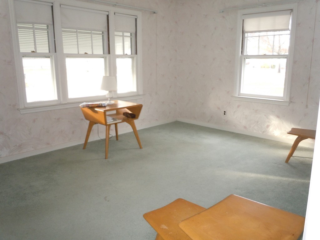 57 Grandview Street Springfield, MA 01118 - Photo 6 of 16 a backyard of a house with table and chairs