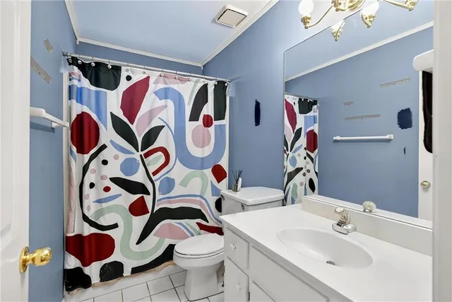 a bathroom with a sink and mirror with toilet