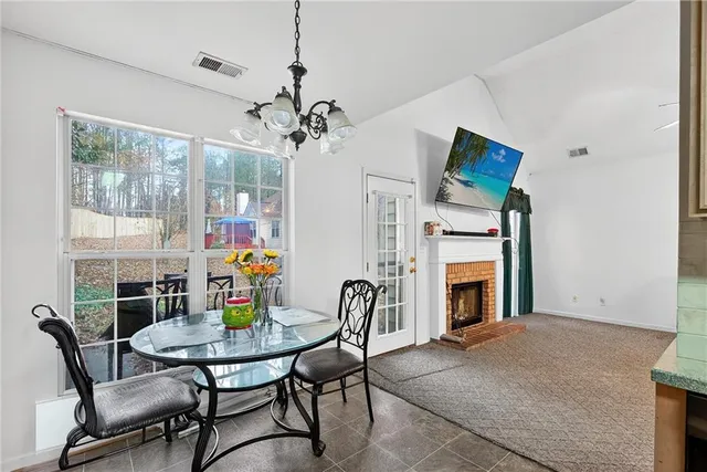 a view of a dining room with furniture window and outside view