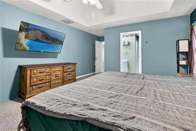 a bedroom with a bed and a dresser