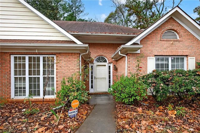 a front view of a house with garden
