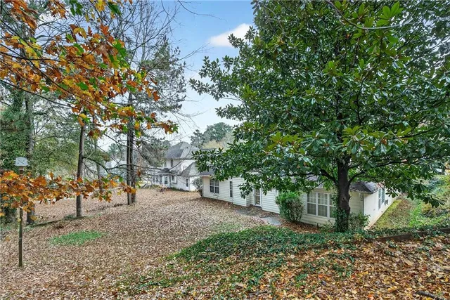 a view of a tree in the middle of a yard