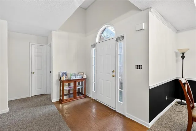 a view of room with hallway and closet