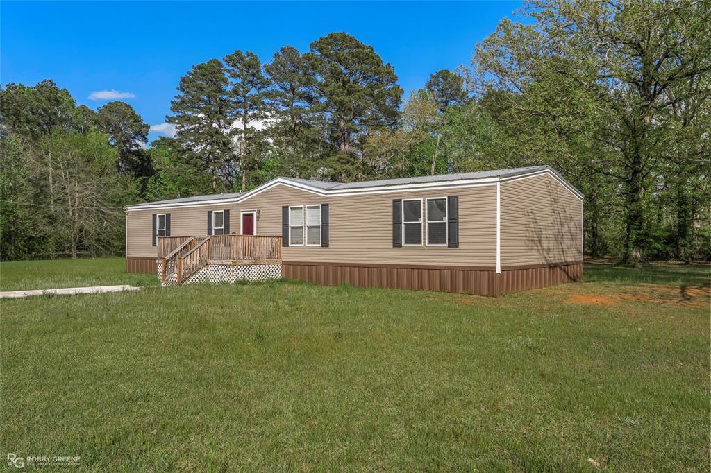 531 King Orchard Road Sarepta, LA 71071 - Photo 2 of 14 Manufactured / mobile home featuring a front yard, a wooden deck