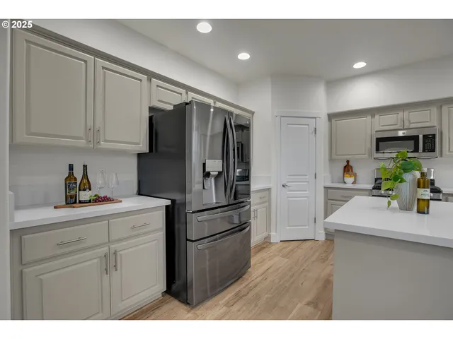 a kitchen with appliances cabinets and a sink