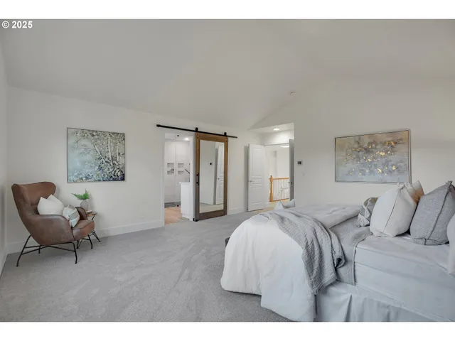 a bedroom with a bed and a couch