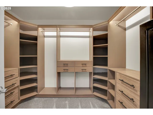 a view of closet area with empty racks