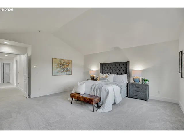 a spacious bedroom with a bed and window