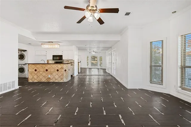 a view of a kitchen with a sink and cabinet area