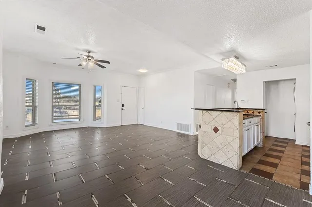 a view of a kitchen with furniture and a window